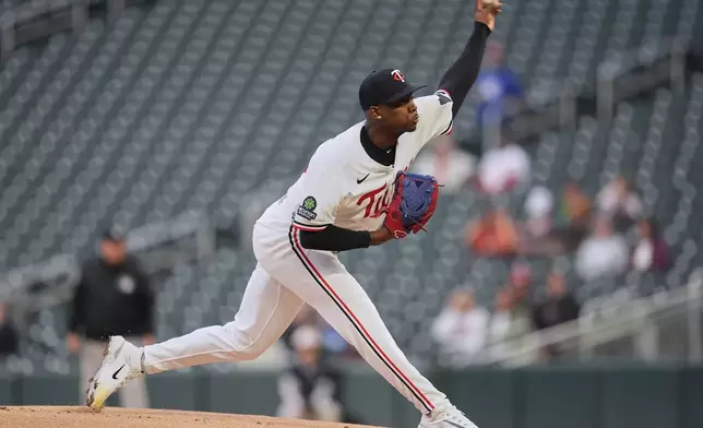 Minnesota Twins starting pitcher Kendry Rojas delivers during the first inning of a baseball game against the Houston Astros, Monday, May 18, 2026, in Minneapolis. (AP Photo/Abbie Parr)