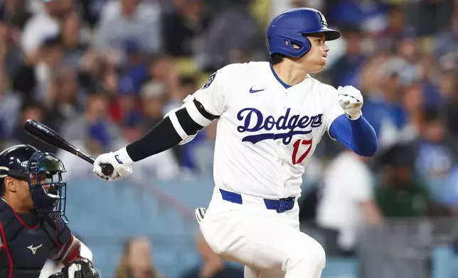 Los Angeles Dodgers' Shohei Ohtani follows through on his swing while grounding out during the third inning of a baseball game against the Atlanta Braves, Friday, May 8, 2026, in Los Angeles. (AP Photo/Jessie Alcheh)