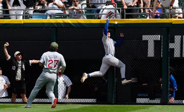 Chicago Cubs center fielder Pete Crow-Armstrong, right, cannot catch a two-run double hit by Chicago White Sox's Miguel Vargas during the fifth inning of a baseball game in Chicago, Sunday, May 17, 2026. (AP Photo/Nam Y. Huh)