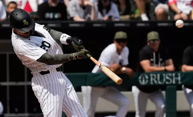 Chicago White Sox's Miguel Vargas hits a two-run double during the fifth inning of a baseball game against the Chicago Cubs in Chicago, Sunday, May 17, 2026. (AP Photo/Nam Y. Huh)