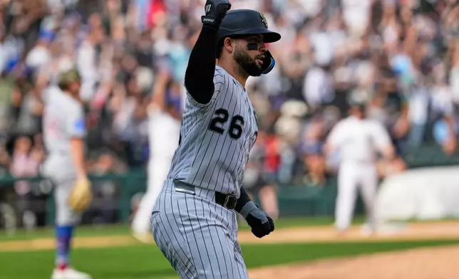 Chicago White Sox's Edgar Quero celebrates as he rounds the bases after hitting the winning two-run home run during the 10th inning of a baseball game against the Chicago Cubs in Chicago, Sunday, May 17, 2026. (AP Photo/Nam Y. Huh)