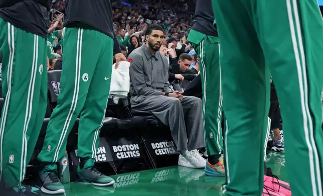 Boston Celtics' Jayson Tatum, who is injured and not playing in the game is on the bench during the first quarter of Game 7 in a first-round NBA basketball playoffs series vs. the Philadelphia 76ers Saturday, May 2, 2026 in Boston. (AP Photo/Jim Davis)