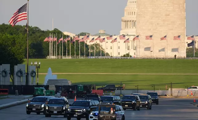 The motorcade with President Donald Trump drives in the Lincoln Memorial Reflecting Pool as he arrives to to see the new blue protective coating being applied as part of a renovation project, Thursday, May 7, 2026, in Washington. (AP Photo/Mark Schiefelbein)