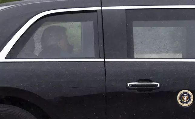 CORRECTS DATE - President Donald Trump sits at the back of the presidential limousine as it drives outside the Walter Reed National Military Medical Center from the White House, Tuesday, May 26, 2026 in Bethesda, Md. (AP Photo/Manuel Balce Ceneta)