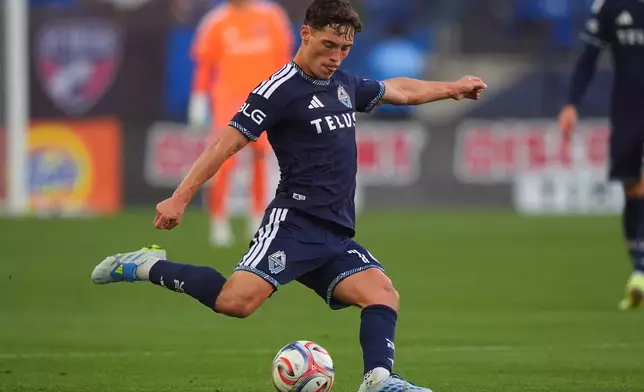 Vancouver Whitecaps FC midfielder Sebastian Berhalter kicks the ball during the first half of an MLS soccer match against FC Dallas in Frisco, Texas, Wednesday, May 13, 2026. (AP Photo/LM Otero)