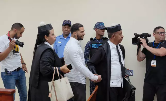 Tampa Bay Rays shortstop Wander Franco, center, leaves court after his trial on charges of sexually abusing a minor in Puerto Plata, Dominican Republic, Monday, May 25, 2026. (AP Photo/Ricardo Hernandez)