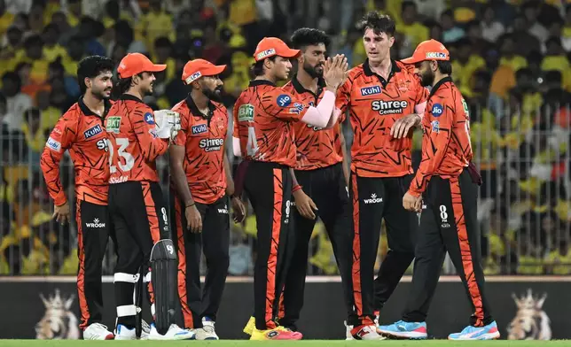Sunrisers Hyderabad's Pat Cummins, second left, celebrates the wicket of Chennai Super Kings' captain Ruturaj Gaikwad with with teammates during the Indian Premier League cricket match between Chennai Super Kings' and Sunrisers Hyderabad in Chennai, India, Monday, May 18, 2026. (AP Photo)