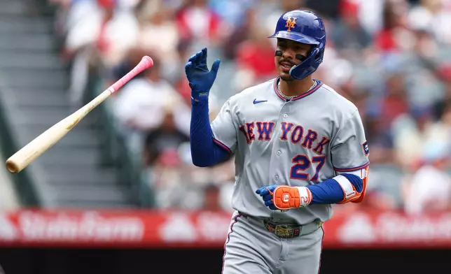 New York Mets' Mark Vientos tosses his bat after hitting a home run during the fourth inning of a baseball game against the Los Angeles Angels, Sunday, May 3, 2026, in Anaheim, Calif. (AP Photo/Jessie Alcheh)