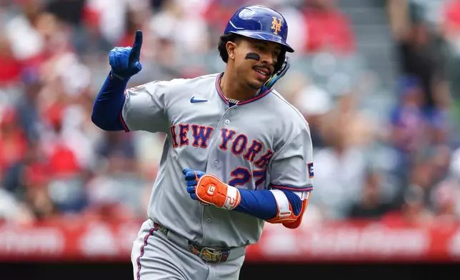 New York Mets' Mark Vientos gestures after hitting a home run during the fourth inning of a baseball game against the Los Angeles Angels, Sunday, May 3, 2026, in Anaheim, Calif. (AP Photo/Jessie Alcheh)