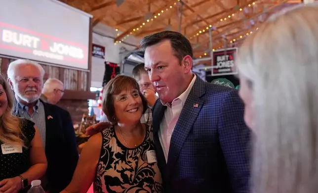Georgia gubernatorial candidate Burt Jones meets with supporters during a primary election night watch party, Tuesday, May 19, 2026, in Jackson, Ga. (AP Photo/Mike Stewart)