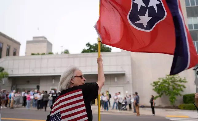 A woman protests against a special session of the state legislature to redraw U.S. Congressional voting maps Tuesday, May 5, 2026, in Nashville, Tenn. (AP Photo/George Walker IV)