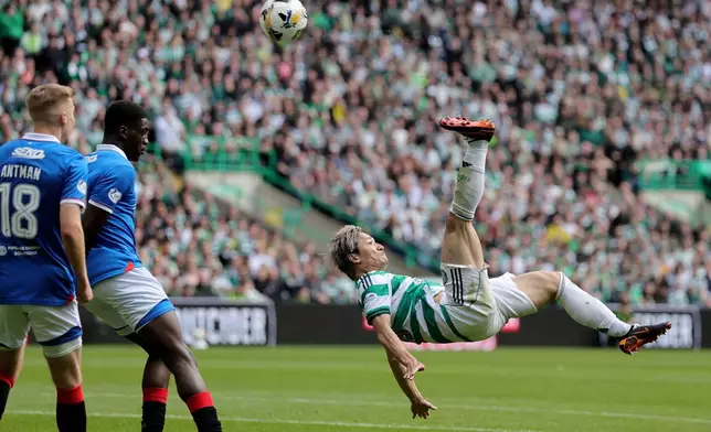 Celtic's Daizen Maeda scores his side's third goal during the Scottish Premiership soccer match between Celtic and Rangers, in Glasgow, Sunday May 10, 2026. (Steve Welsh/PA via AP)
