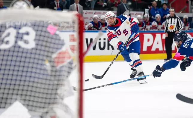 USA's Justin Faulk shoots the puck, during the 2026 IIHF Men's Ice Hockey World Championship preliminary round group A game between Britain and the United States, in Zurich, Switzerland, Sunday, May 17, 2026. (Claudio Thoma/Keystone via AP)