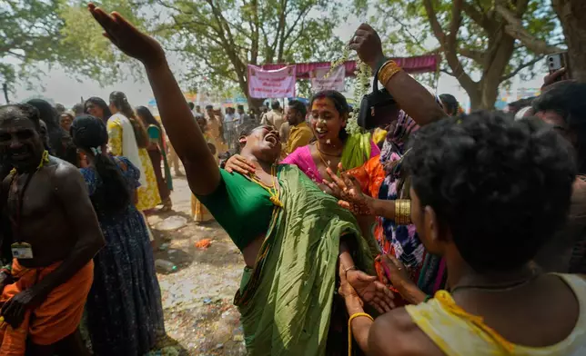 Transgender participants mourn the end of symbolic marriage to the Hindu god Aravan during the Koovagam festival in Kallakurichi district of the southern Indian state of Tamil Nadu, Wednesday, April 29, 2026. (AP Photo/Mahesh Kumar A.)