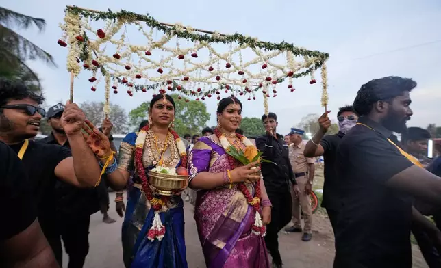 Transgender participants celebrate amid fanfare after symbolically marrying the Hindu god Aravan during the Koovagam festival in the Kallakurichi district of the southern Indian state of Tamil Nadu, Tuesday, April 28, 2026. (AP Photo/Mahesh Kumar A.)