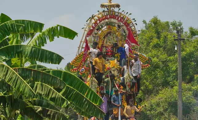 A chariot procession of the Hindu god Aravan is taken out during the Koovagam transgender festival in Kallakurichi district of the southern Indian state of Tamil Nadu, Wednesday, April 29, 2026. (AP Photo/Mahesh Kumar A.)