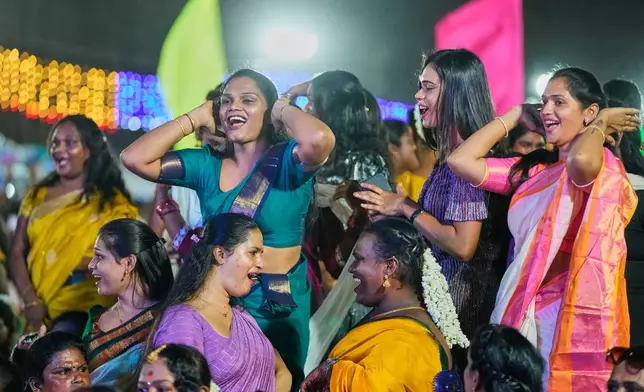 Transgender participants dance during the Miss Koovagam 2026 beauty pageant at the Koovagam festival in Villupuram, India, Monday, April 27, 2026. (AP Photo/Mahesh Kumar A.)
