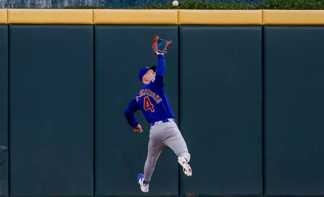 Chicago Cubs center fielder Pete Crow-Armstrong catches a fly ball hit by Atlanta Braves designated hitter Dominic Smith during the fifth inning of a baseball game, Thursday, May 14, 2026, in Atlanta. (AP Photo/Erik S. Lesser)