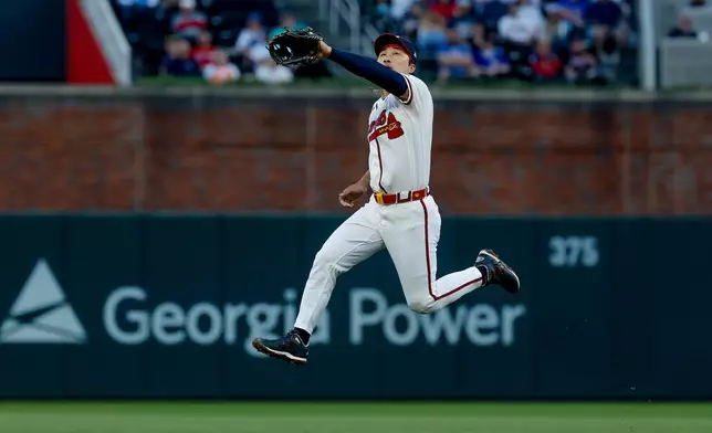 Atlanta Braves shortstop Ha-Seong Kim tries to field a single hit by Chicago Cubs' Pete Crow-Armstrong during the second inning of a baseball game, Thursday, May 14, 2026, in Atlanta. (AP Photo/Erik S. Lesser)