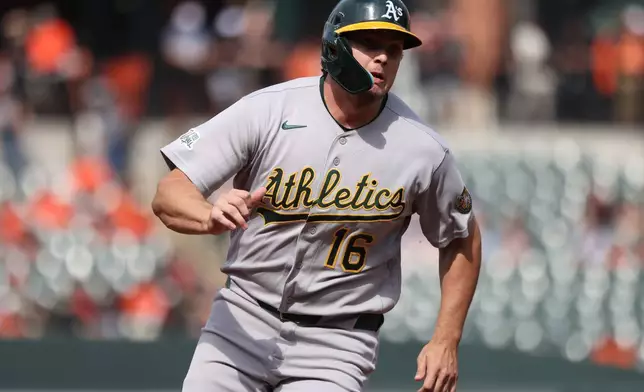 Athletics' Nick Kurtz rounds third base to score during the first inning of a baseball game against the Baltimore Orioles, Saturday, May 9, 2026, in Baltimore. (AP Photo/Daniel Kucin Jr.)