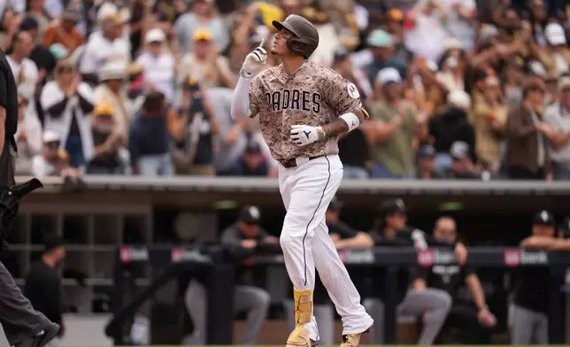 San Diego Padres' Manny Machado celebrates his home run during the fourth inning of a baseball game against the Chicago White Sox Sunday, May 3, 2026, in San Diego. (AP Photo/Gregory Bull)