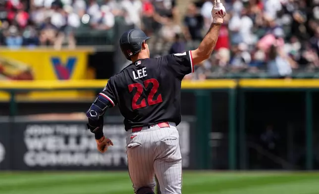 Minnesota Twins' Brooks Lee celebrates as he rounds the bases after hitting a solo home run during the first inning of a baseball game against the Chicago White Sox in Chicago, Monday, May 25, 2026. (AP Photo/Nam Y. Huh)