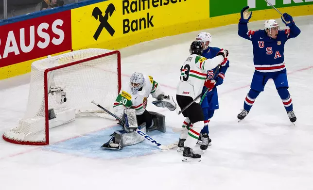 Ryan Leonard of the U.S., right, celebrates after his side's first goal of the game during the 2026 IIHF Men's Ice Hockey World Championship preliminary round group A game between United States and Hungary, in Zurich, Switzerland, Monday, May 25, 2026. (Andreas Becker/Keystone via AP)