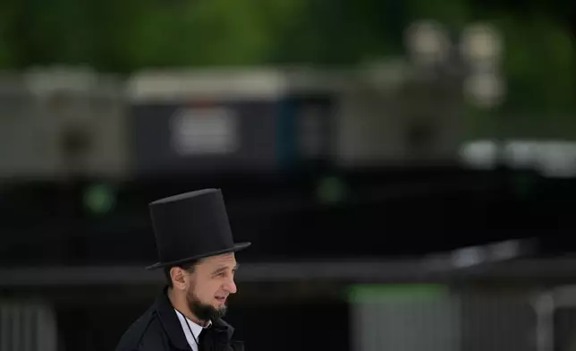 A guest dressed as Abraham Lincoln attends the Rededicate 250: A National Jubilee Of Prayer, Praise &amp; Thanksgiving, Sunday, May 17, 2026, in Washington. (AP Photo/Rod Lamkey, Jr.)