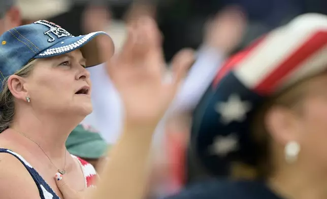 A guest attends the Rededicate 250: A National Jubilee Of Prayer, Praise &amp; Thanksgiving, Sunday, May 17, 2026, in Washington. (AP Photo/Rod Lamkey, Jr.)