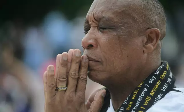 A guest attends the Rededicate 250: A National Jubilee Of Prayer, Praise &amp; Thanksgiving, Sunday, May 17, 2026, in Washington. (AP Photo/Rod Lamkey, Jr.)