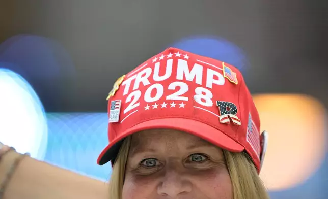 A guest attends the Rededicate 250: A National Jubilee Of Prayer, Praise &amp; Thanksgiving, Sunday, May 17, 2026, in Washington. (AP Photo/Rod Lamkey, Jr.)