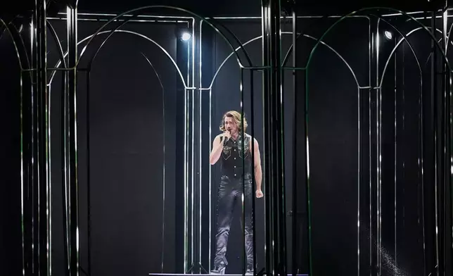 Aidan from Malta performs the song "Bella" during the dress rehearsal for the second semifinal of the 70th Eurovision Song Contest in Vienna, Austria, Wednesday, May 13, 2026. (AP Photo/Martin Meissner)