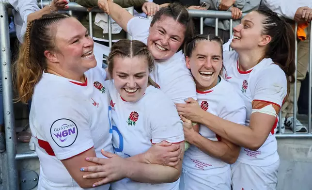 England players celebrate after winning the Six Nations rugby union match between France and England in Bordeaux, Sunday, May 17, 2026. (AP Photo/Yohan Bonnet)