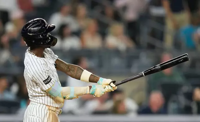New York Yankees' Jazz Chisholm Jr. looks after his two-run home run during the seventh inning of a baseball game against the Toronto Blue Jays, Monday, May 18, 2026, in New York. (AP Photo/Seth Wenig)