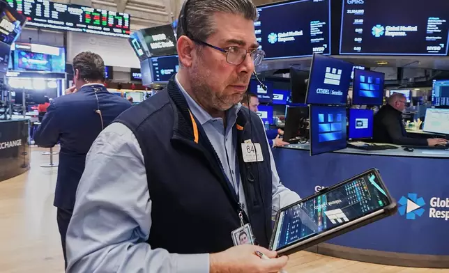 Trader Michael Capolino works on the floor of the New York Stock Exchange, Wednesday, May 13, 2026. (AP Photo/Richard Drew)