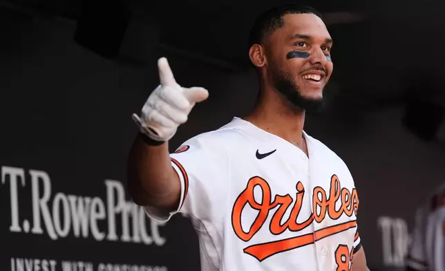 Baltimore Orioles' Jeremiah Jackson (82) celebrates with teammates after hitting a grand slam during the seventh inning in the first baseball game of a doubleheader against the Houston Astros, Thursday, April 30, 2026, in Baltimore. (AP Photo/Stephanie Scarbrough)