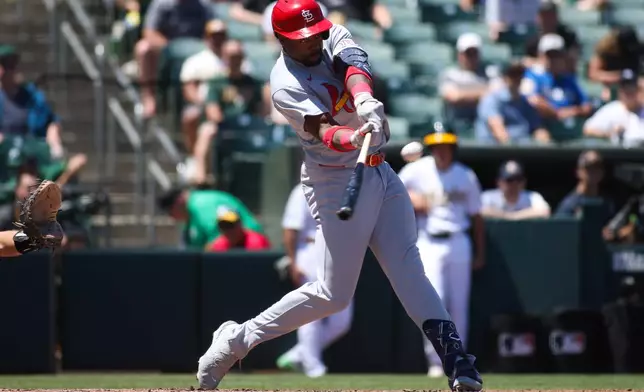 St. Louis Cardinals' Jordan Walker hits a solo home run during the sixth inning of a baseball game against the Athletics, Thursday, May 14, 2026, in West Sacramento, Calif. (AP Photo/Scott Marshall)