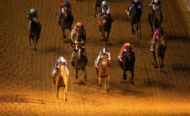 Always a Runner, front left, ridden by Jose L. Ortiz wins the 152nd running of the Kentucky Oaks horse race at Churchill Downs, Friday, May 1, 2026, in Louisville, Ky. (AP Photo/Charlie Riedel)