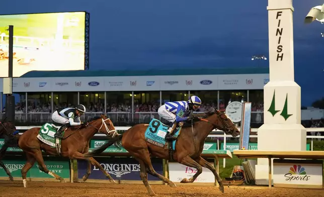 Always a Runner (9) ridden by Jose L. Ortiz wins the 152nd running of the Kentucky Oaks followed by Meaning (5) ridden by Juan J. Hernandez horse race at Churchill Downs, Friday, May 1, 2026, in Louisville, Ky. (AP Photo/Jeff Roberson)