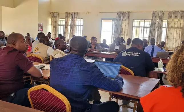 People meet at the Ituri Provincial Health Directorate for the first Ebola response meeting in Bunia, Congo, Friday, May 15, 2026. (AP Photo/Jorkim Jotham Pituwa)
