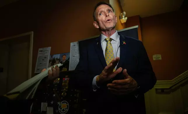 Republican congressional candidate for Kentucky, Ed Gallrein, participates in an interview during the Kenton County Republican Party Lincoln Day Dinner, Thursday, April 30, 2026, in Covington, Ky. (AP Photo/Jon Cherry)