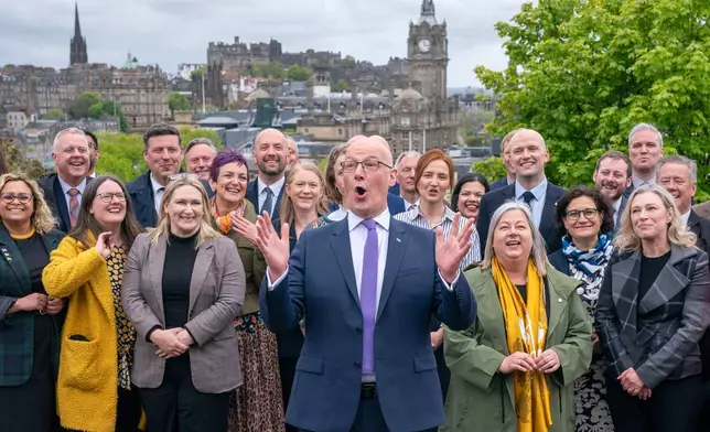 First Minister and SNP leader John Swinney with some of the newly elected SNP MSPs in Edinburgh, Saturday May 9, 2026, following the 2026 Holyrood elections. (Jane Barlow/PA via AP)