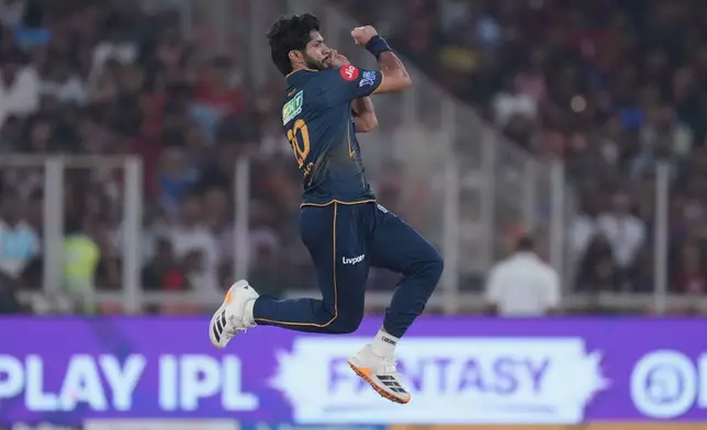 Gujarat Titans' Arshad Khan bowls a delivery during the Indian Premier League cricket match between Gujarat Titans and Royal Challengers Bengaluru in Ahmedabad, India, Thursday, April 30, 2026. (AP Photo/Ajit Solanki)