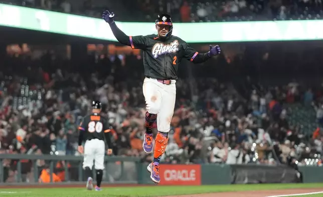 San Francisco Giants' Willy Adames celebrates after hitting a home run against the Arizona Diamondbacks during the ninth inning of a baseball game Tuesday, May 26, 2026, in San Francisco. (AP Photo/Jeff Chiu)