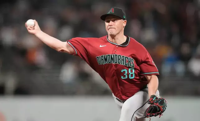 Arizona Diamondbacks pitcher Paul Sewald (38) throws against the San Francisco Giants during the ninth inning of a baseball game Tuesday, May 26, 2026, in San Francisco. (AP Photo/Jeff Chiu)