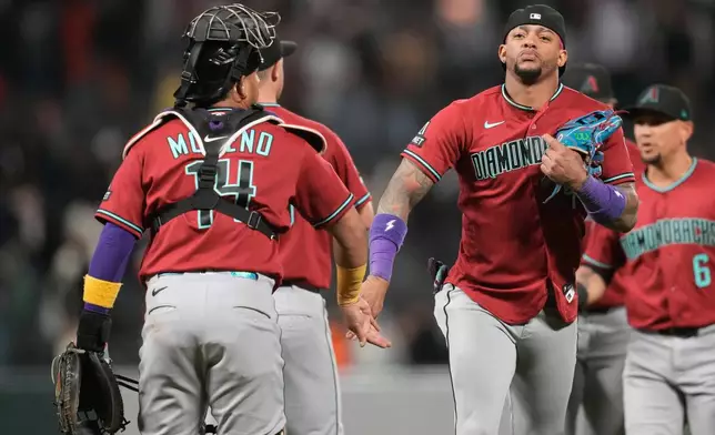 Arizona Diamondbacks' Gabriel Moreno, left, celebrates with Ketel Marte after a baseball game against the San Francisco Giants Tuesday, May 26, 2026, in San Francisco. (AP Photo/Jeff Chiu)