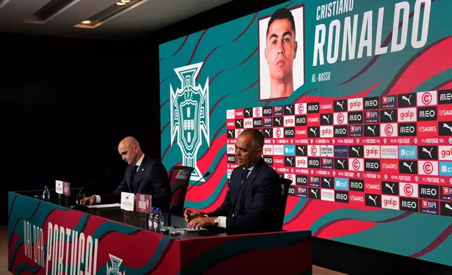 Portugal's head coach Roberto Martinez calls the name of Cristiano Ronaldo when announcing the squad for the 2026 World Cup, in Oeiras, outside Lisbon, Tuesday, May 19, 2026. (AP Photo/Armando Franca)