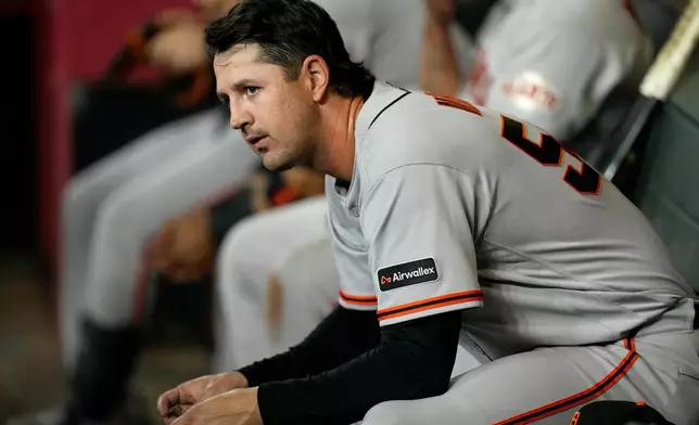 San Francisco Giants starting pitcher Tyler Mahle pauses in the team dugout during the fifth inning of a baseball game against the Arizona Diamondbacks, Wednesday, May 20, 2026, in Phoenix. (AP Photo/Ross D. Franklin)