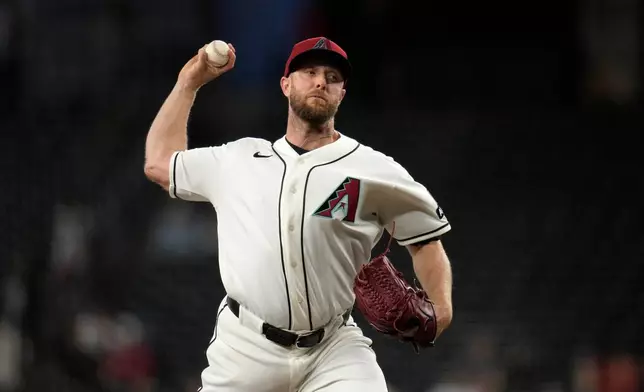 Arizona Diamondbacks starting pitcher Merrill Kelly throws against the San Francisco Giants during the first inning of a baseball game, Wednesday, May 20, 2026, in Phoenix. (AP Photo/Ross D. Franklin)