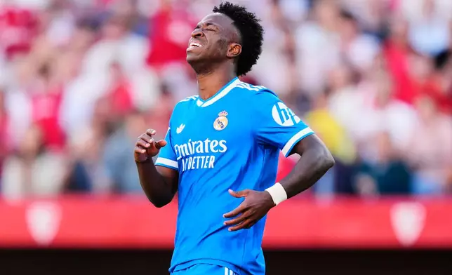 Real Madrid's Vinicius Junior reacts during the Spanish La Liga soccer match between Real Madrid and Sevilla at the Ramon Sanchez Pizjuan stadium in Seville, Spain, Sunday, May 17, 2026. (AP Photo/Jose Breton)